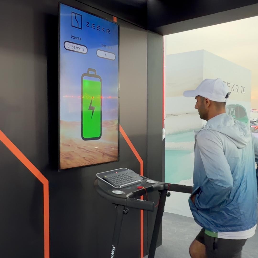 Interactive Treadmill Activation in Dubai: Participants generating human power to recharge EV cars